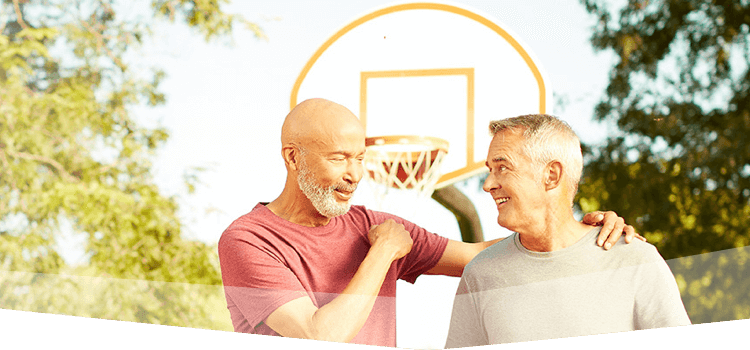 Banner photo at the top of the page featuring two men wearing athletic clothing and having a friendly conversation with each other on a basketball court.  