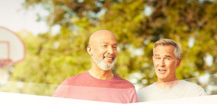 Banner photo at the top of the page showing two men having a friendly conversation on an outdoor basketball court in between one-on-one games.  